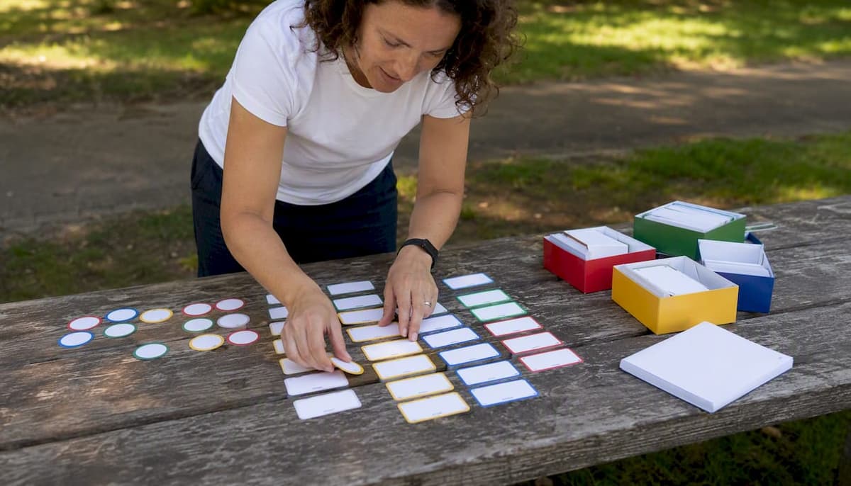 Teacher's hands arranging language learning flashcards