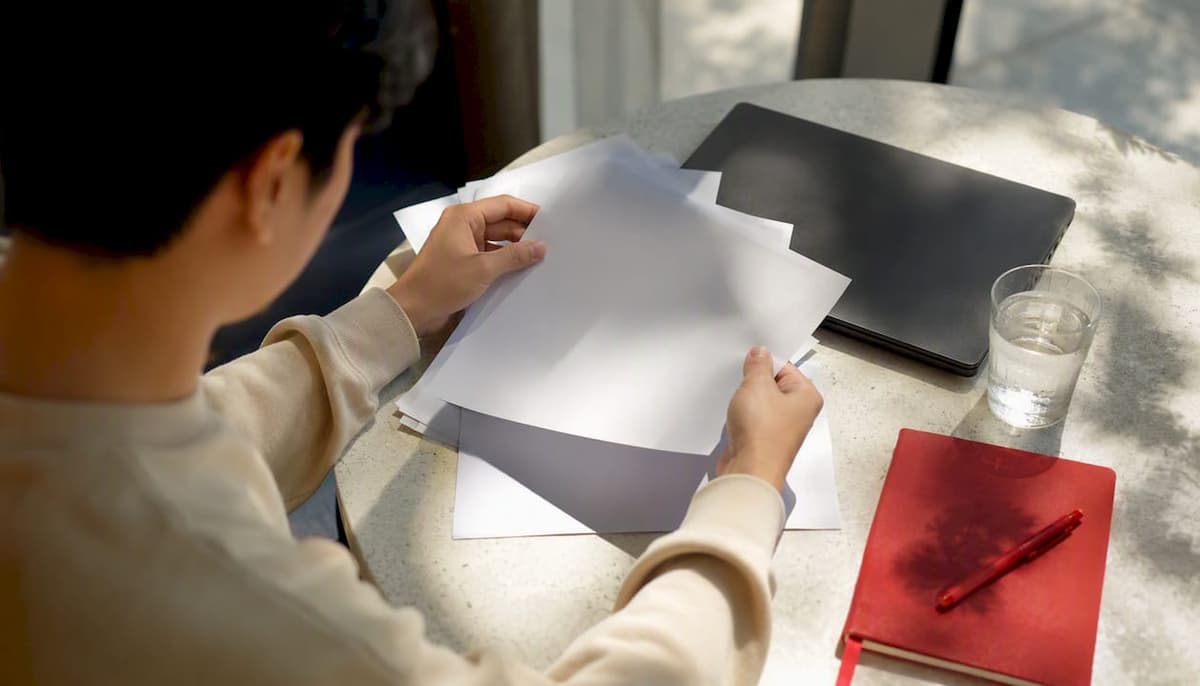 Hands organizing citizenship English proof documents