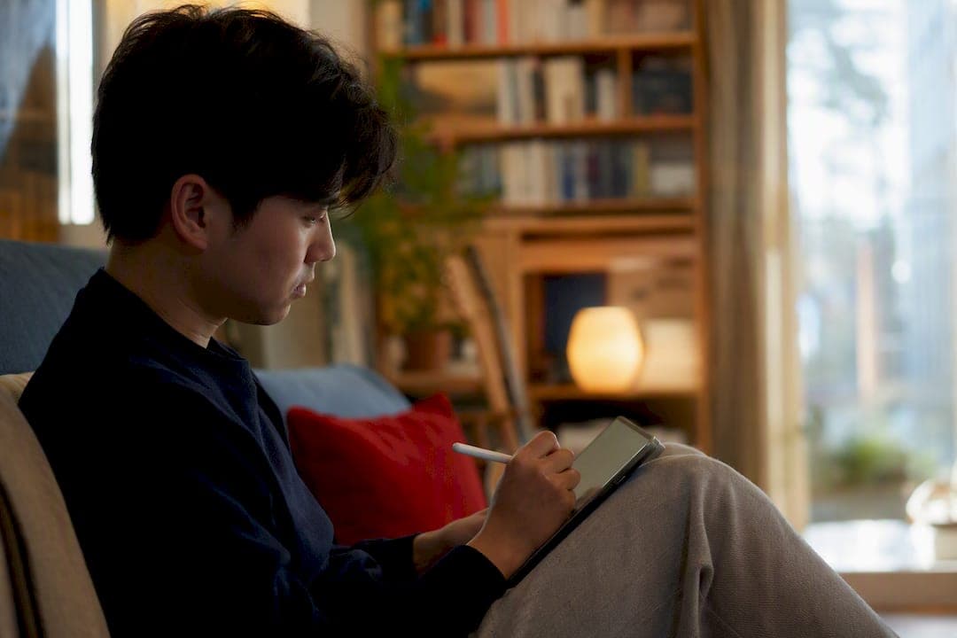 Hand writing shorthand notes on tablet